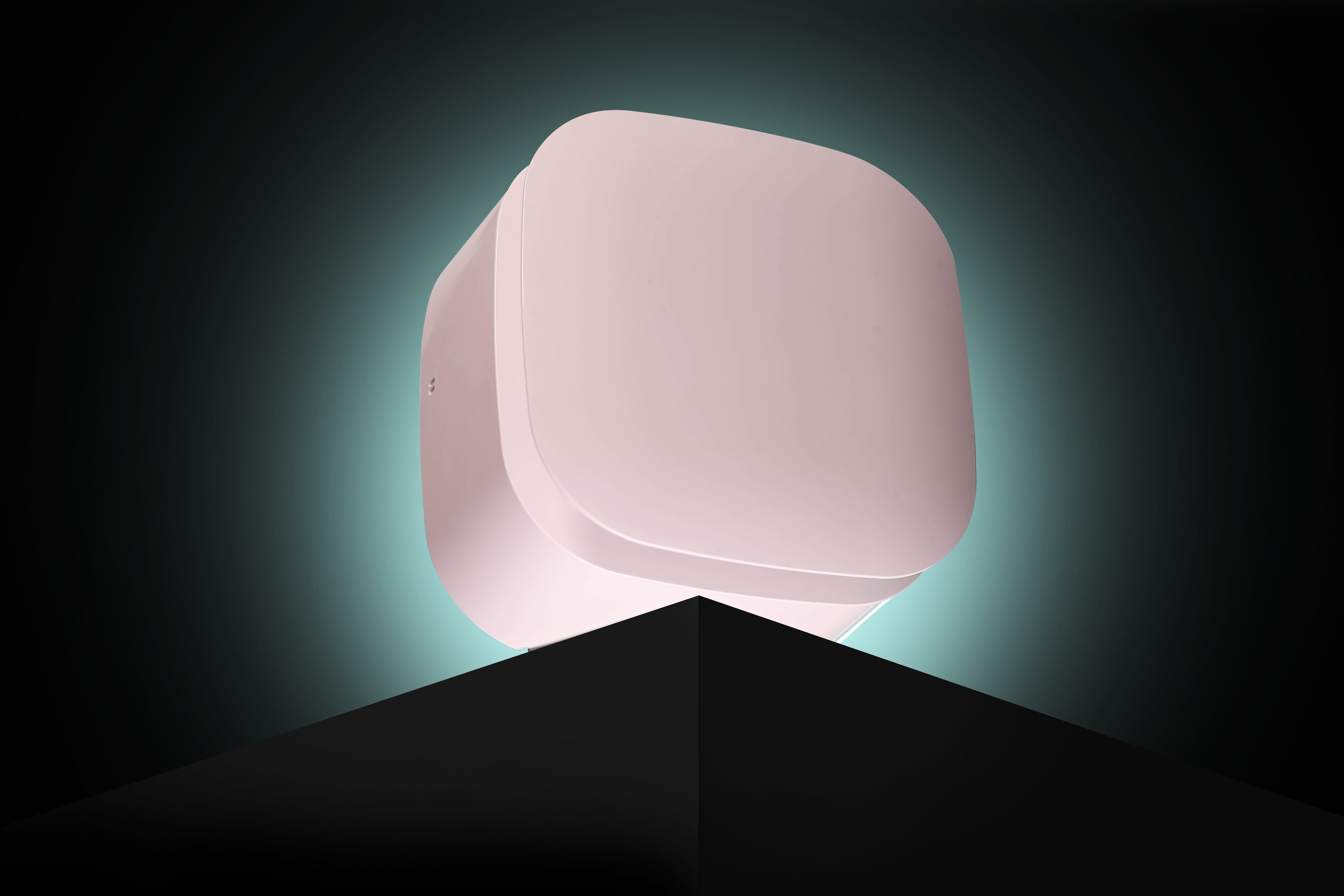 White square ventilation system on a black platform with a dark background with teal lighting